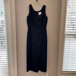Black sleeveless dress with silk pattern down front, zipper in back. Size 8